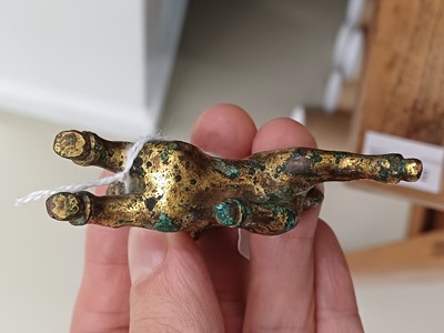 Lot 318 - A CHINESE GILT-BRONZE MODEL OF A RAM