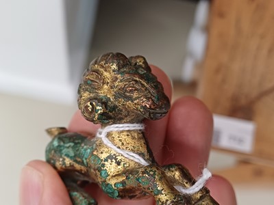 Lot 318 - A CHINESE GILT-BRONZE MODEL OF A RAM