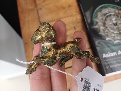 Lot 318 - A CHINESE GILT-BRONZE MODEL OF A RAM