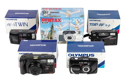 Lot 1081 - Five Olympus and Pentax point and shoot cameras boxed.