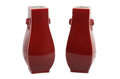 Lot 206 - A PAIR OF CHINESE MONOCHROME RED-GLAZED VASES