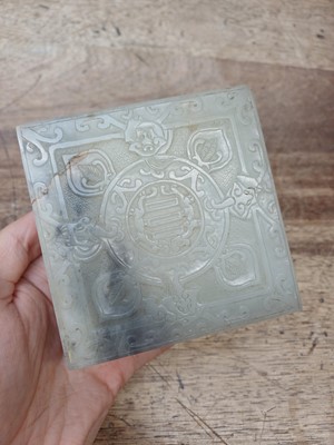 Lot 42 - A CHINESE PALE-CELADON JADE 'TWELVE ORNAMENTS' BOX AND COVER