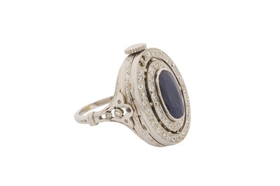 Lot 47 - A SAPPHIRE AND DIAMOND WATCH RING