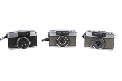 Lot 1143 - Three Olympus Pen cameras.