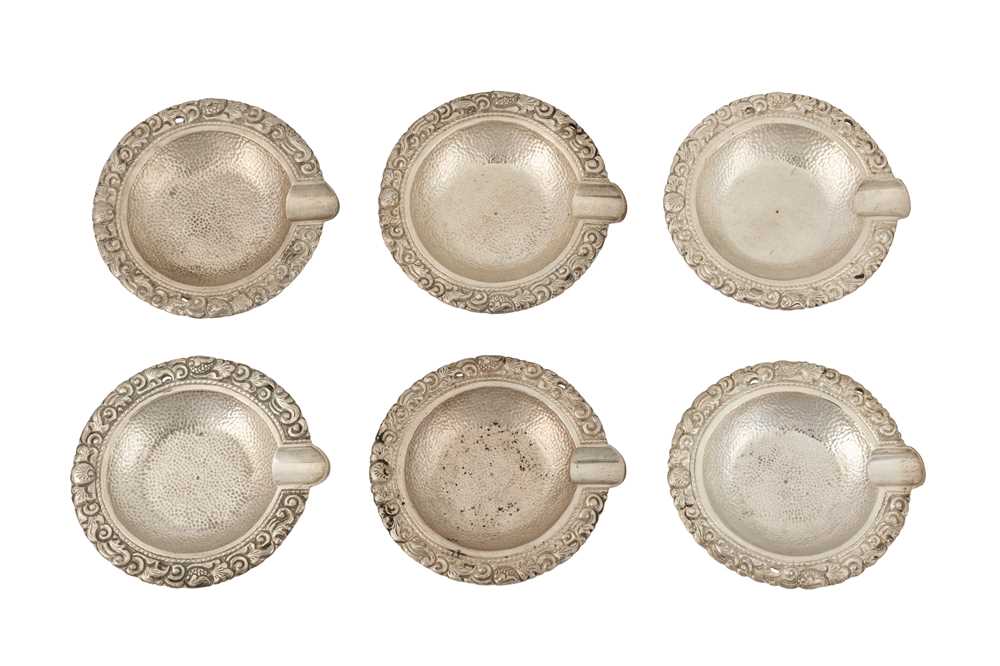 Lot 134 - A SET OF SIX MID-20TH CENTURY INDONESIAN SILVER ASHTRAYS