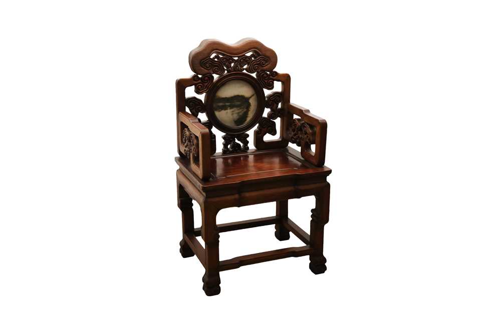 Lot 25 - A CHINESE HONGMU HARDWOOD CARVED 'RUYI CLOUDS'