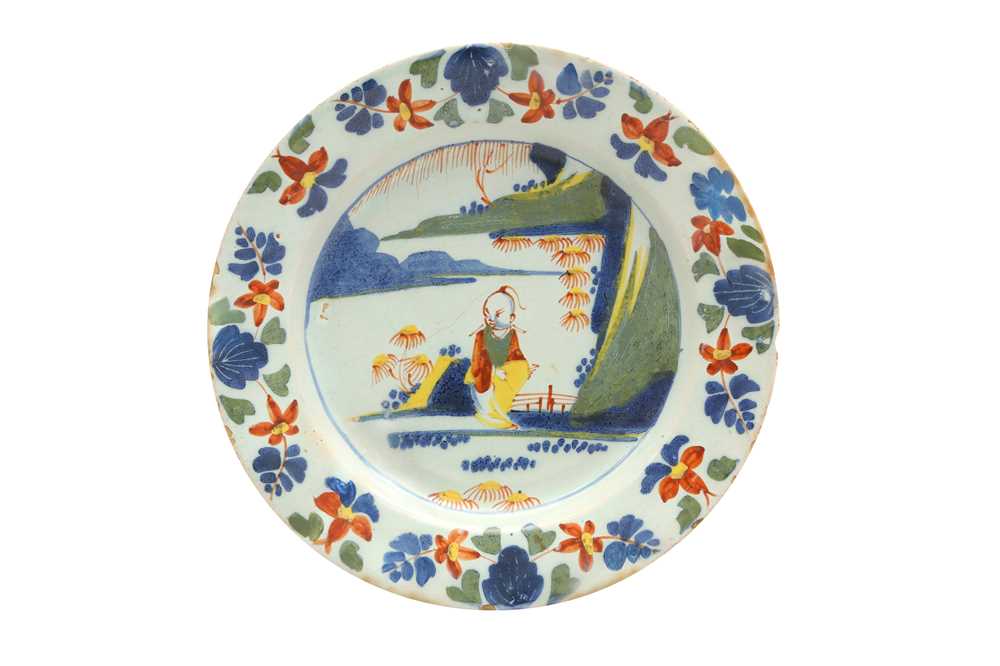 Lot 136 - A POLYCHROME BRISTOL OR LAMBETH DELFTWARE PLATE, 18TH CENTURY