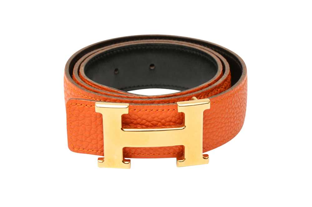 Lot 24 - Hermes Orange Clemence Constance Belt - Size 80
