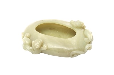 Lot 939 - A CHINESE CELADON JADE 'CHILONG' WASHER