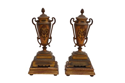 Lot 448 - A FRENCH EARLY 20TH CENTURY BRASS CLOCK GARNITURE SET OF ARCHITECTURAL FORM