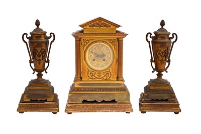 Lot 448 - A FRENCH EARLY 20TH CENTURY BRASS CLOCK GARNITURE SET OF ARCHITECTURAL FORM