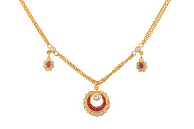 Lot 128 - A RUBY AND DIAMOND PENDANT NECKLACE