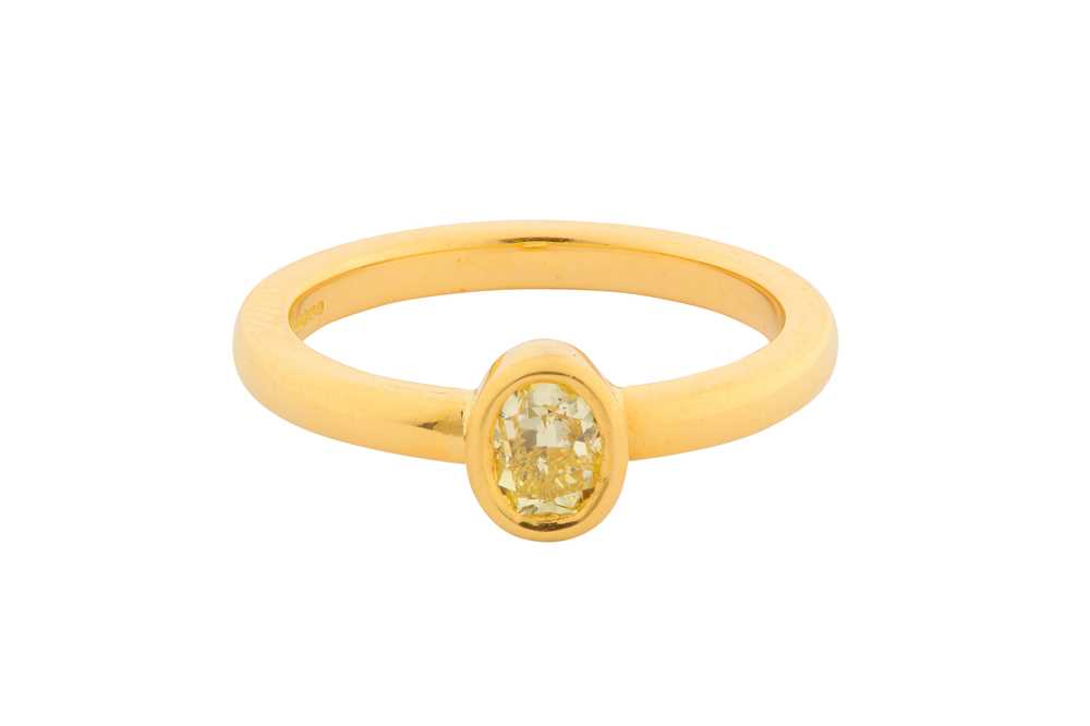 Lot 189 - A FANCY YELLOW DIAMOND SINGLE-STONE RING