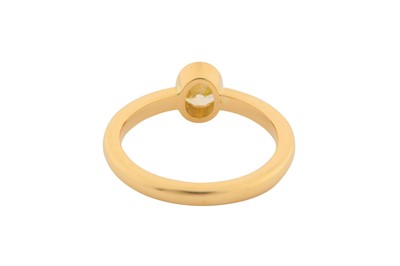 Lot 189 - A FANCY YELLOW DIAMOND SINGLE-STONE RING