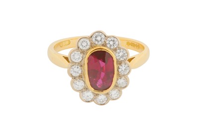 Lot 118 - A RUBY AND DIAMOND CLUSTER RING