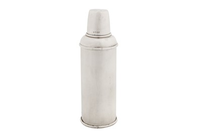 Lot 30 - A George V sterling silver cased thermos flask, Chester 1910 by G & Co