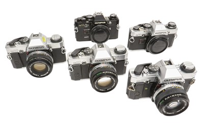Lot 112 - Five Olympus OM cameras.