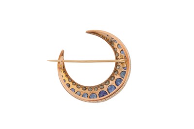 Lot 35 - A SAPPHIRE AND DIAMOND CRESCENT  MOON BROOCH