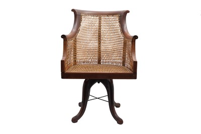 Lot 801 - AN EDWARDIAN STRUNG AND CROSSBANDED CANED MAHOGANY DESK CHAIR