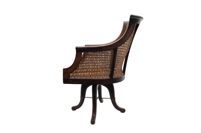 Lot 801 - AN EDWARDIAN STRUNG AND CROSSBANDED CANED MAHOGANY DESK CHAIR