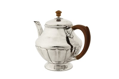 Lot 307 - A George V ‘Arts and Crafts’ sterling silver three-piece tea service, Birmingham 1927 by William Hair Haseler for Liberty