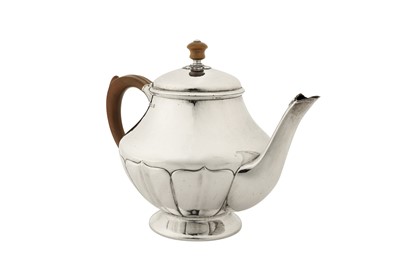 Lot 307 - A George V ‘Arts and Crafts’ sterling silver three-piece tea service, Birmingham 1927 by William Hair Haseler for Liberty