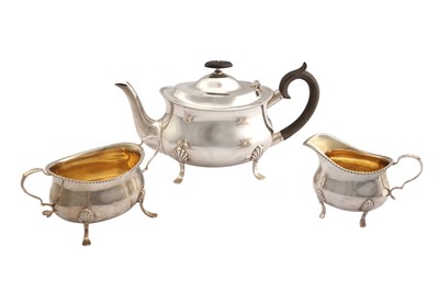 Lot 255 - A George V sterling silver three-piece tea-service, Sheffield 1915 by William Hutton