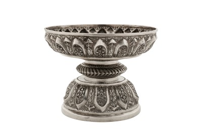 Lot 151 - A graduated pair of early 20th century Cambodian unmarked silver dish on stands (tok), circa 1930