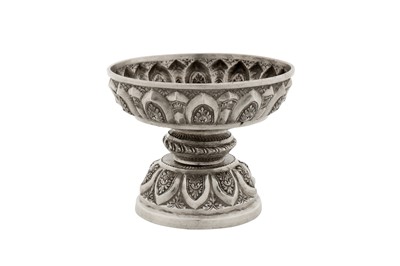 Lot 151 - A graduated pair of early 20th century Cambodian unmarked silver dish on stands (tok), circa 1930