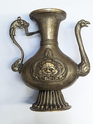 Lot 348 - A TIBETAN BRONZE EWER AND COVER