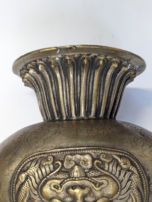 Lot 348 - A TIBETAN BRONZE EWER AND COVER