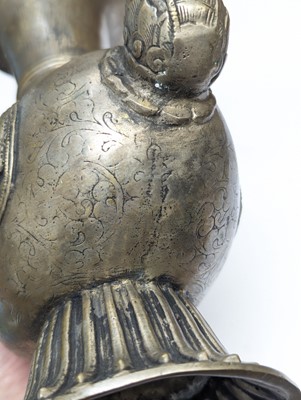 Lot 348 - A TIBETAN BRONZE EWER AND COVER