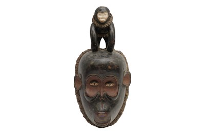 Lot 319 - A GABON MBULU CARVED AND PAINTED WOOD MONKEY MASK