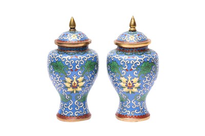 Lot 245 - A PAIR OF CHINESE CLOISONNÉ ENAMEL JARS AND COVERS