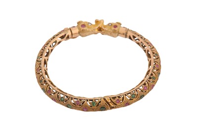 Lot 10 - A RUBY AND EMERALD BANGLE