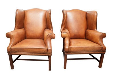 Lot 370 - A PAIR OF GEORGIAN STYLE TAN LEATHER WINGBACK ARMCHAIRS