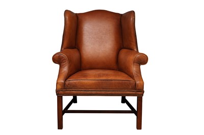 Lot 369 - A GEORGIAN STYLE TAN LEATHER WINGBACK ARMCHAIR