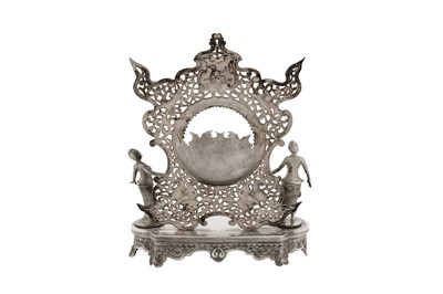 Lot 139 - An unusual late 19th / early 20th century Burmese unmarked silver watch stand holder, Rangoon circa 1900