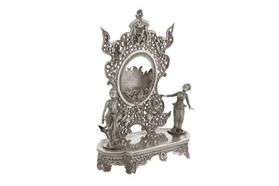 Lot 139 - An unusual late 19th / early 20th century Burmese unmarked silver watch stand holder, Rangoon circa 1900