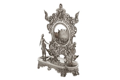 Lot 139 - An unusual late 19th / early 20th century Burmese unmarked silver watch stand holder, Rangoon circa 1900