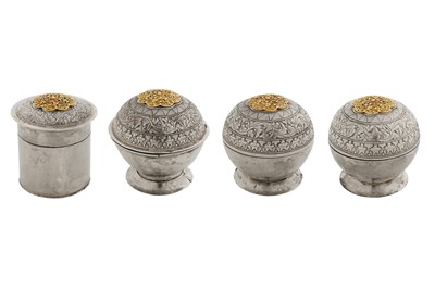 Lot 164 - A set of four late 19th / early 20th century Malay unmarked gold mounted silver lime and salve boxes, probably Lower Perak circa 1900