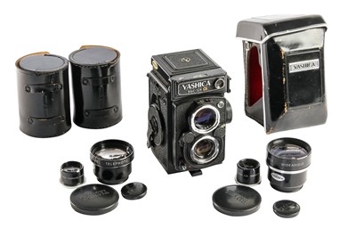 Lot 219 - A Yashica 124G & Lens Attachments.