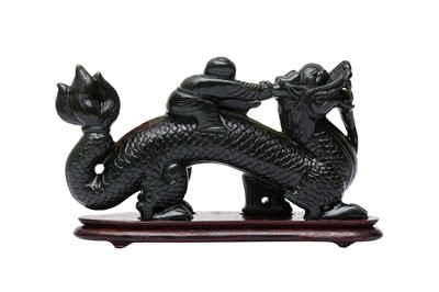 Lot 206 - A CHINESE HARDSTONE 'BOY AND DRAGON' CARVING