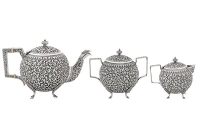Lot 114 - A late 19th century Anglo – Indian unmarked silver three-piece tea service, Cutch circa 1880
