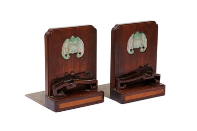 Lot 141 - A PAIR OF CHINESE HARDWOOD BOOKENDS INLAID WITH JADE PLAQUES