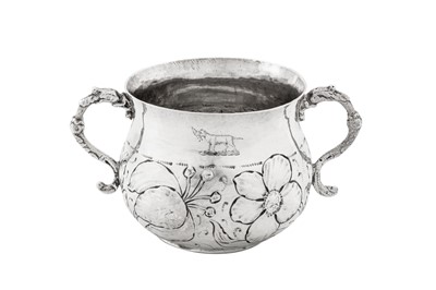 Lot 488 - A Charles II sterling silver porringer, London 1677 by TH above a rosette (unidentified)