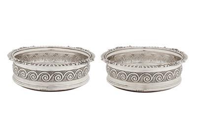 Lot 451 - A pair of George III sterling silver wine coasters, London 1812 by Solomon Hougham