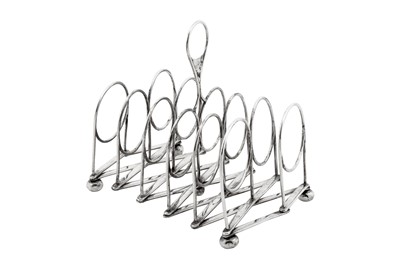 Lot 431 - A George III sterling silver patent extending toast rack, Sheffield 1816 by Samuel Roberts, George Cadman and Co