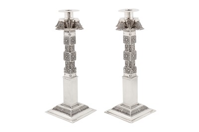 Lot 148 - A pair of mid-20th century Ceylonese (Sri Lankan) silver candlesticks, Kandy circa 1920 by Kandyan Arts Association