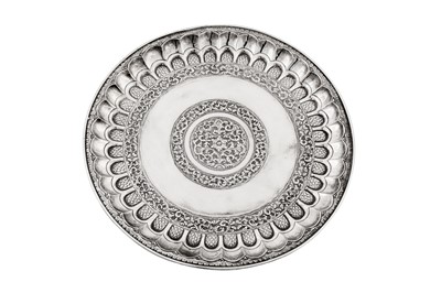 Lot 84 - An early 20th century Indian unmarked silver dish (thali), South Indian